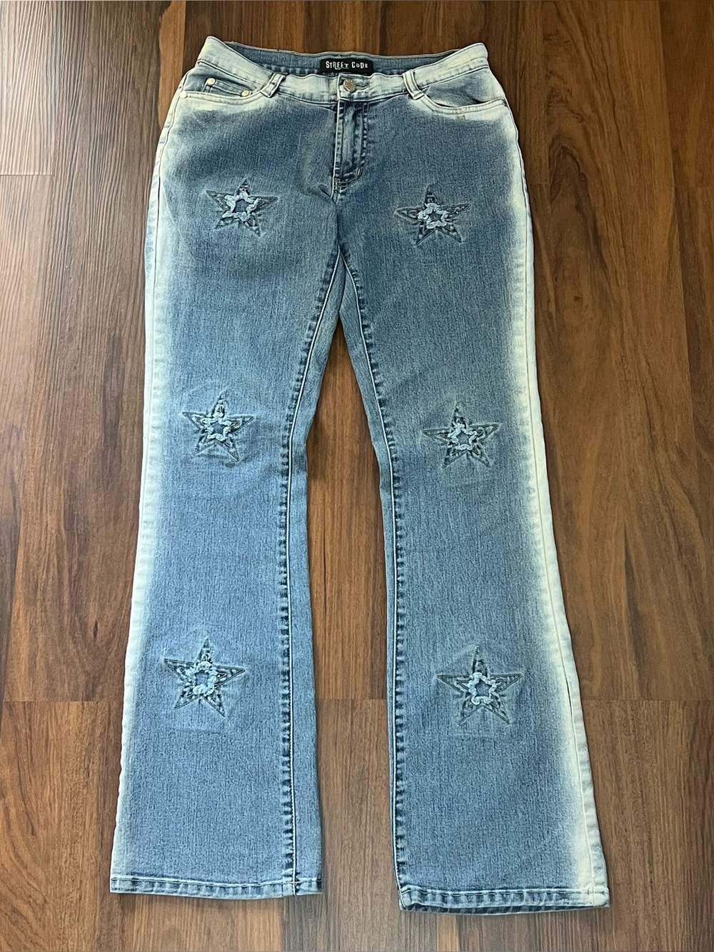 Vintage Y2K Street Code jeans with distressed star patch details